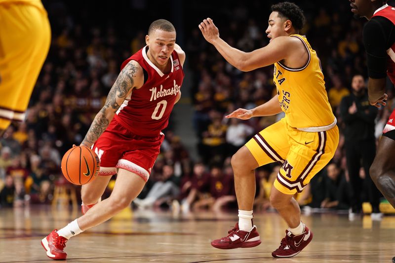 Jan 7, 2023; Minneapolis, Minnesota, USA; Nebraska Cornhuskers guard C.J. Wilcher (0) dribbles the ball while Minnesota Golden Gophers guard Taurus Samuels (0) defends during the second half at Williams Arena. Mandatory Credit: Matt Krohn-USA TODAY Sports