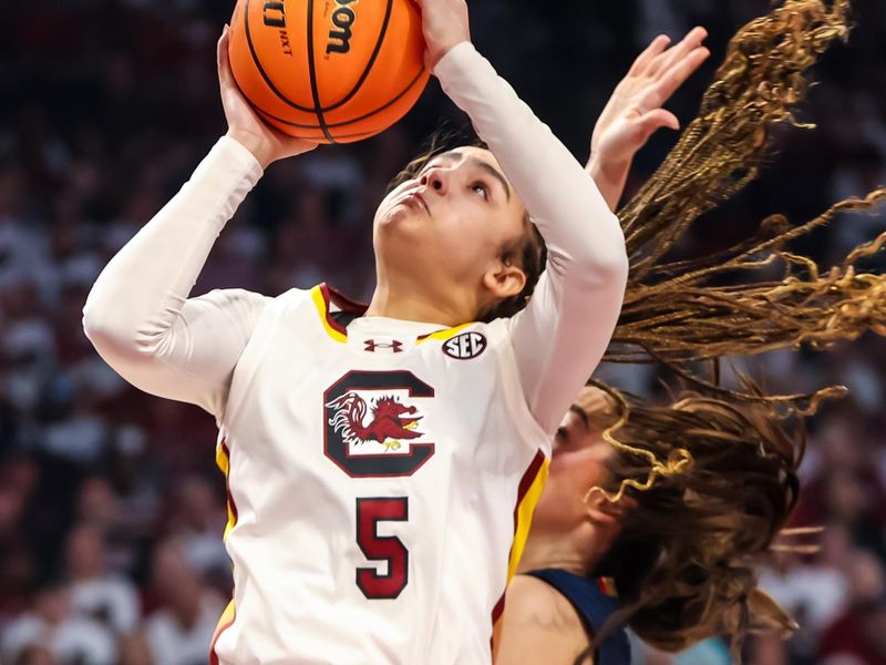 Feb 11, 2024; Columbia, South Carolina, USA; South Carolina Gamecocks guard Tessa Johnson (5) shoots the ball against the UConn Huskies in the first half at Colonial Life Arena. Mandatory Credit: Jeff Blake-USA TODAY Sports