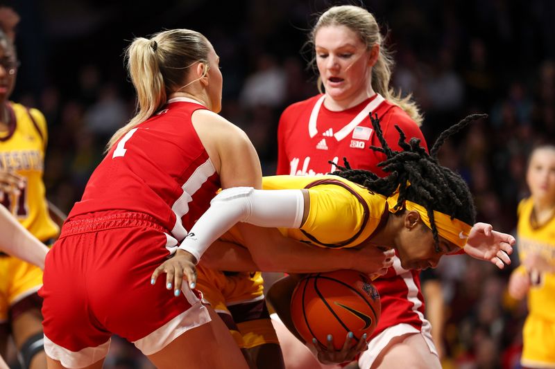 Jan 14, 2024; Minneapolis, Minnesota, USA; Minnesota Golden Gophers guard Janay Sanders (30) controls the ball as Nebraska Cornhuskers guard Jaz Shelley (1) defends during the second half at Williams Arena. Mandatory Credit: Matt Krohn-USA TODAY Sports