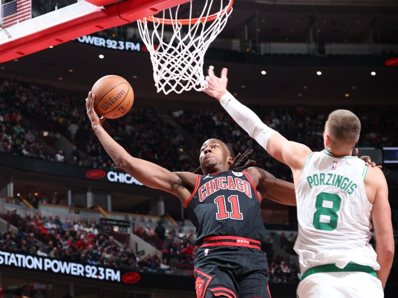 CHICAGO, IL - NOVEMBER 29: Ayo Dosunmu #11 of the Chicago Bulls drives to the basket during the game against the Boston Celtics during the Emirates NBA Cup game on November 29, 2024 at United Center in Chicago, Illinois. NOTE TO USER: User expressly acknowledges and agrees that, by downloading and or using this photograph, User is consenting to the terms and conditions of the Getty Images License Agreement. Mandatory Copyright Notice: Copyright 2024 NBAE (Photo by Jeff Haynes/NBAE via Getty Images)