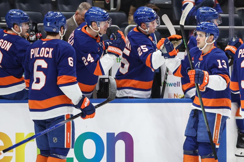 Jan 16, 2025; Elmont, New York, USA;  New York Islanders center Mathew Barzal (13) celebrates after scoring a goal in the third period against the Philadelphia Flyers at UBS Arena. Mandatory Credit: Wendell Cruz-Imagn Images