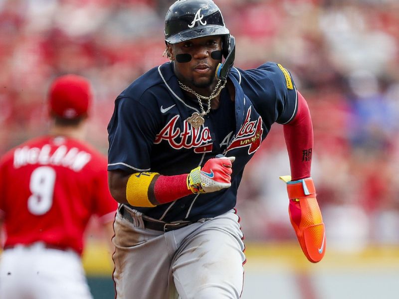 Jun 24, 2023; Cincinnati, Ohio, USA; Atlanta Braves right fielder Ronald Acuna Jr. (13) runs to third on a sacrifice fly hit by third baseman Austin Riley (not pictured) in the first inning against the Cincinnati Reds at Great American Ball Park. Mandatory Credit: Katie Stratman-USA TODAY Sports