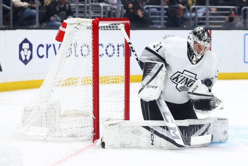 Dec 27, 2023; Los Angeles, California, USA; Los Angeles Kings goaltender David Rittich (31) makes a save against the San Jose Sharks during the third period of a game at Crypto.com Arena. Mandatory Credit: Jessica Alcheh-USA TODAY Sports