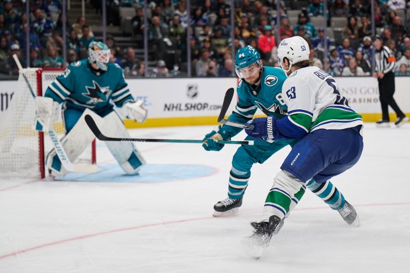 Nov 2, 2024; San Jose, California, USA; San Jose Sharks defenseman Jan Rutta (84) skates against Vancouver Canucks center Teddy Blueger (53) during the third period at SAP Center at San Jose. Mandatory Credit: Robert Edwards-Imagn Images