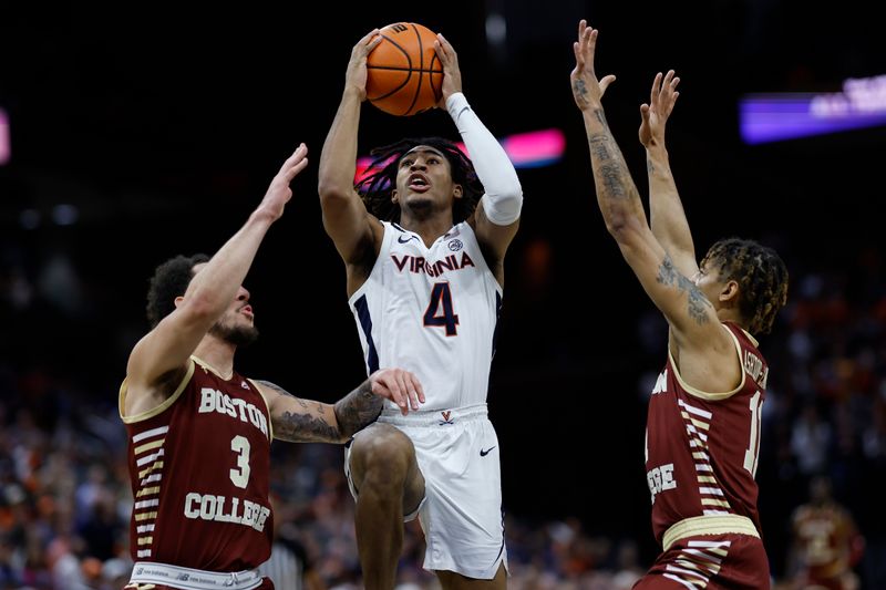 Jan 28, 2023; Charlottesville, Virginia, USA; Virginia Cavaliers guard Armaan Franklin (4) drives to the basket as Boston College Eagles guard Jaeden Zackery (3) and Eagles guard Makai Ashton-Langford (11) defend in the second half at John Paul Jones Arena. Mandatory Credit: Geoff Burke-USA TODAY Sports