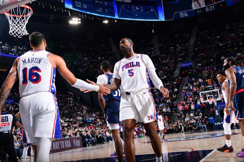 INGLEWOOD, CA - NOVEMBER 6: Caleb Martin #16 and Andre Drummond #5 of the Philadelphia 76ers high five during the game against the LA Clippers on November 6, 2024 at Intuit Dome in Los Angeles, California. NOTE TO USER: User expressly acknowledges and agrees that, by downloading and/or using this Photograph, user is consenting to the terms and conditions of the Getty Images License Agreement. Mandatory Copyright Notice: Copyright 2024 NBAE (Photo by Adam Pantozzi/NBAE via Getty Images)