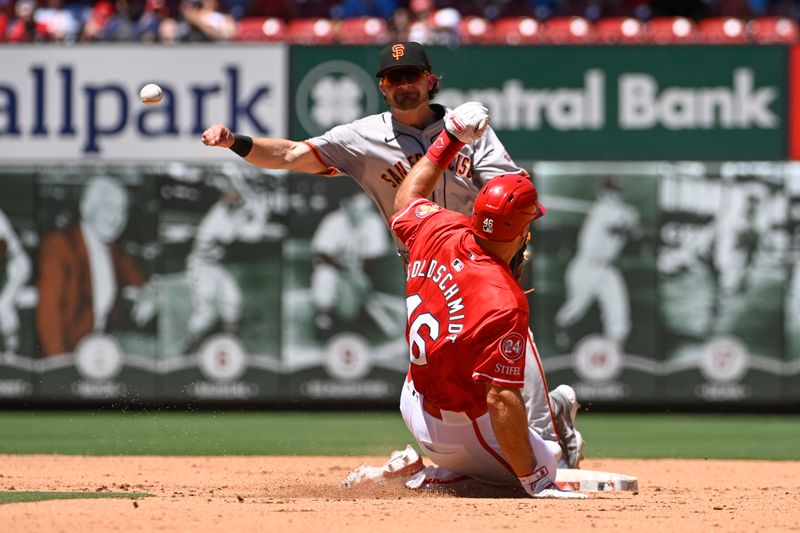 Jun 23, 2024; St. Louis, Missouri, USA; St. Louis Cardinals first baseman Paul Goldschmidt (46) is out at second base as San Francisco Giants shortstop Brett Wisely (0) is unable to turn a double play in the fifth inning at Busch Stadium. Mandatory Credit: Joe Puetz-USA TODAY Sports