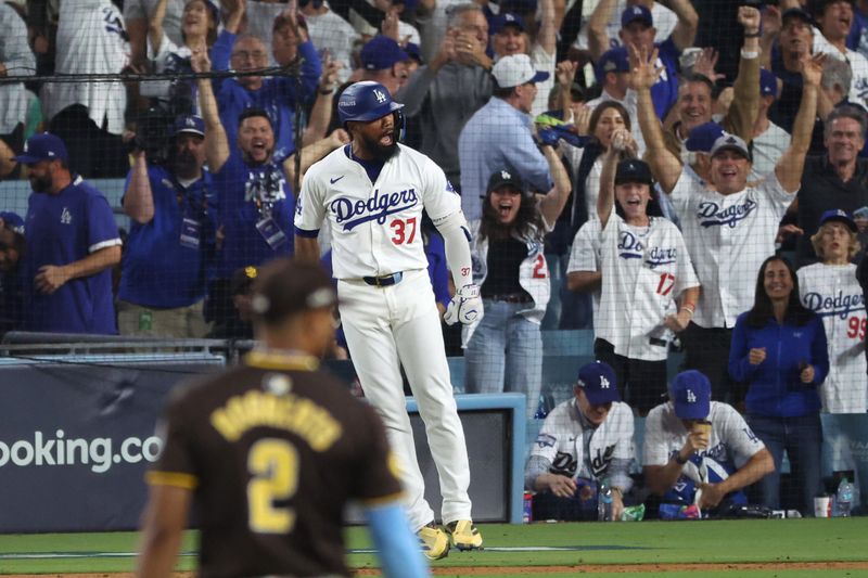 Oct 11, 2024; Los Angeles, California, USA; Los Angeles Dodgers outfielder Teoscar Hernandez (37) celebrates after hitting a solo home run in the seventh inning against the San Diego Padres during game five of the NLDS for the 2024 MLB Playoffs at Dodger Stadium. Mandatory Credit: Kiyoshi Mio-Imagn Images