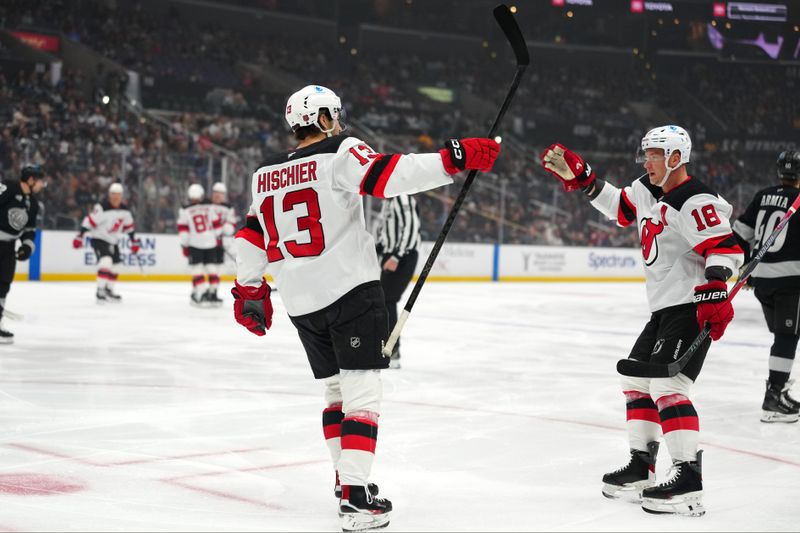 Nov 1, 2025; Los Angeles, California, USA; New Jersey Devils center Nico Hischier (13) and left wing Ondrej Palat (18) celebrate after a goal against the Los Angeles Kings in the first period at Crypto.com Arena. Mandatory Credit: Kirby Lee-Imagn Images