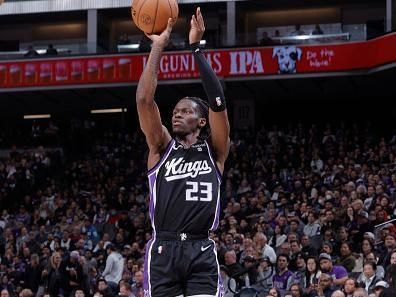 SACRAMENTO, CA - DECEMBER 14: Keon Ellis #23 of the Sacramento Kings shoots a three point basket during the game against the Oklahoma City Thunder on December 14, 2023 at Golden 1 Center in Sacramento, California. NOTE TO USER: User expressly acknowledges and agrees that, by downloading and or using this Photograph, user is consenting to the terms and conditions of the Getty Images License Agreement. Mandatory Copyright Notice: Copyright 2023 NBAE (Photo by Rocky Widner/NBAE via Getty Images)