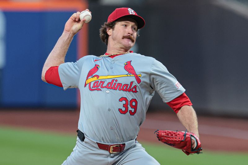 Apr 26, 2024; New York City, New York, USA; St. Louis Cardinals starting pitcher Miles Mikolas (39) delivers a pitch against the New York Mets during the first inning at Citi Field. Mandatory Credit: Vincent Carchietta-USA TODAY Sports