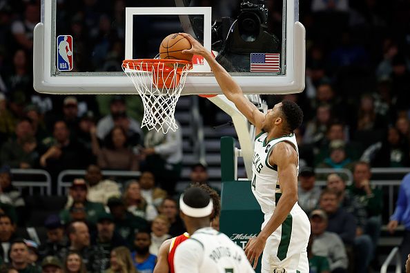 MILWAUKEE, WISCONSIN - OCTOBER 29: Giannis Antetokounmpo #34 of the Milwaukee Bucks scores on a dunk in the second half against the Atlanta Hawks at Fiserv Forum on October 29, 2023 in Milwaukee, Wisconsin. NOTE TO USER: User expressly acknowledges and agrees that, by downloading and or using this photograph, User is consenting to the terms and conditions of the Getty Images License Agreement. (Photo by John Fisher/Getty Images)