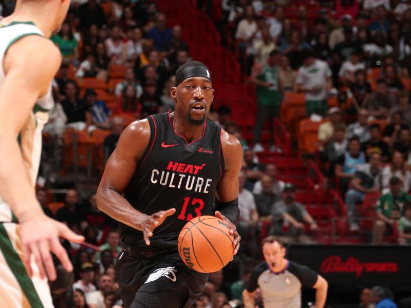 MIAMI, FL - FEBRUARY 11: Bam Adebayo #13 of the Miami Heat dribbles the ball during the game against the Boston Celtics on February 11, 2024 at Kaseya Center in Miami, Florida. NOTE TO USER: User expressly acknowledges and agrees that, by downloading and or using this Photograph, user is consenting to the terms and conditions of the Getty Images License Agreement. Mandatory Copyright Notice: Copyright 2024 NBAE (Photo by Issac Baldizon/NBAE via Getty Images)