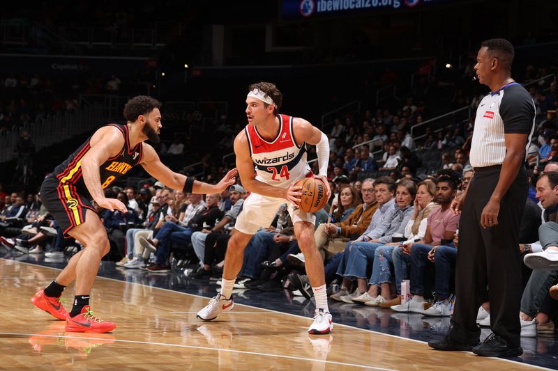 WASHINGTON, DC -? OCTOBER 30: Corey Kispert #24 of the Washington Wizards handles the ball during the game against the Atlanta Hawks on October 30, 2024 at Capital One Arena in Washington, DC. NOTE TO USER: User expressly acknowledges and agrees that, by downloading and or using this Photograph, user is consenting to the terms and conditions of the Getty Images License Agreement. Mandatory Copyright Notice: Copyright 2024 NBAE (Photo by Stephen Gosling/NBAE via Getty Images)