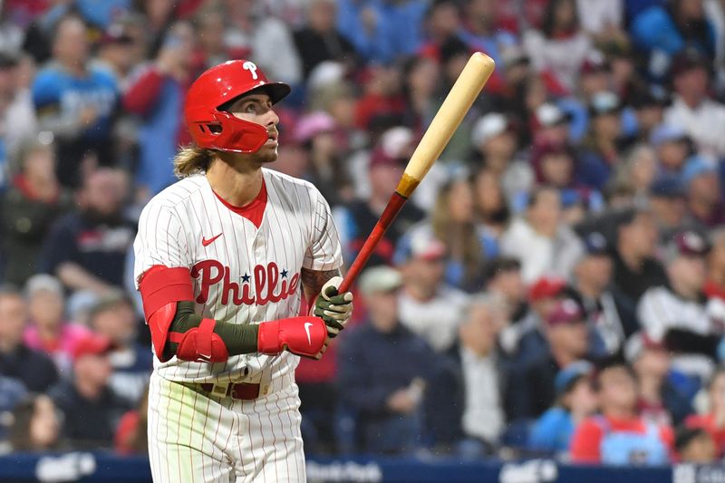 May 19, 2024; Philadelphia, Pennsylvania, USA; Philadelphia Phillies second base Bryson Stott (5) hits a home run during the seventh inning against the Washington Nationals at Citizens Bank Park. Mandatory Credit: Eric Hartline-USA TODAY Sports