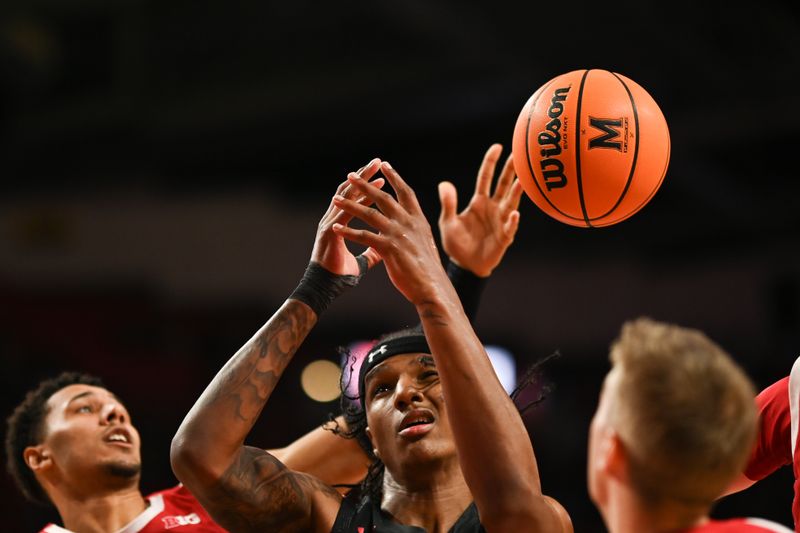 Jan 25, 2023; College Park, Maryland, USA;  Maryland Terrapins forward Julian Reese (10) reacts as Wisconsin Badgers guard Jordan Davis (2) swats a rebound attempt away during the second half at Xfinity Center. Mandatory Credit: Tommy Gilligan-USA TODAY Sports