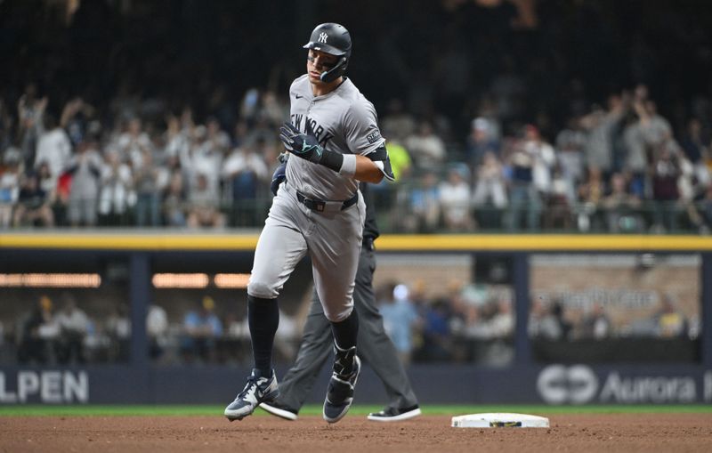 Apr 27, 2024; Milwaukee, Wisconsin, USA; New York Yankees outfielder Aaron Judge (99) rounds the bases after hitting a home run against the Milwaukee Brewers in the sixth inning at American Family Field. Mandatory Credit: Michael McLoone-USA TODAY Sports