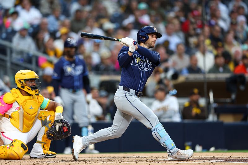 Apr 25, 2025; San Diego, California, USA; Tampa Bay Rays second baseman Brandon Lowe (8) singles during the third inning against the San Diego Padres at Petco Park. Mandatory Credit: Chadd Cady-Imagn Images