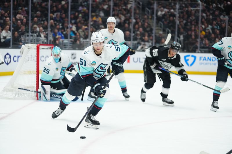 Dec 23, 2025; Los Angeles, California, USA; Seattle Kraken center Shane Wright (51) skates with the puck against the LA Kings in the second period at Crypto.com Arena. Mandatory Credit: Kirby Lee-Imagn Images