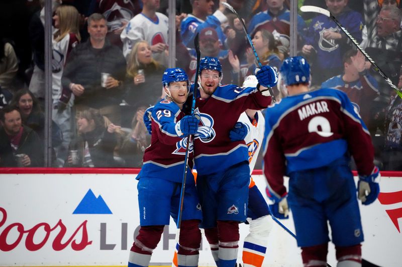 Jan 2, 2024; Denver, Colorado, USA; Colorado Avalanche right wing Valeri Nichushkin (13) celebrates his goal with center Nathan MacKinnon (29) in the third period against the New York Islanders at Ball Arena. Mandatory Credit: Ron Chenoy-USA TODAY Sports