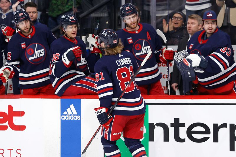 Apr 2, 2023; Winnipeg, Manitoba, CAN; Winnipeg Jets left wing Kyle Connor (81) celebrates his second period goal against the New Jersey Devils at Canada Life Centre. Mandatory Credit: James Carey Lauder-USA TODAY Sports