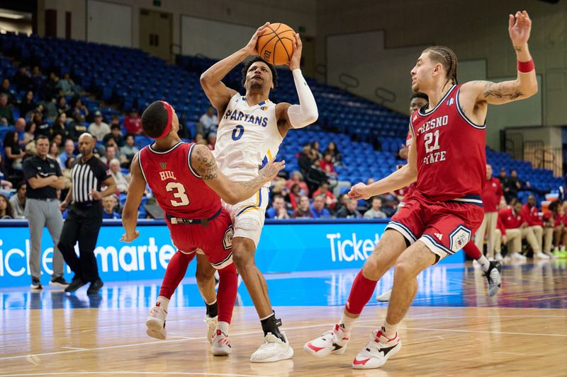 Feb 6, 2024; San Jose, California, USA; San Jose State Spartans guard Myron Amey Jr. (0) drives with the ball against Fresno State Bulldogs guards Isaiah Hill (3) and Isaiah Pope (21) during the second half at Provident Credit Union Event Center. Mandatory Credit: Robert Edwards-USA TODAY Sports