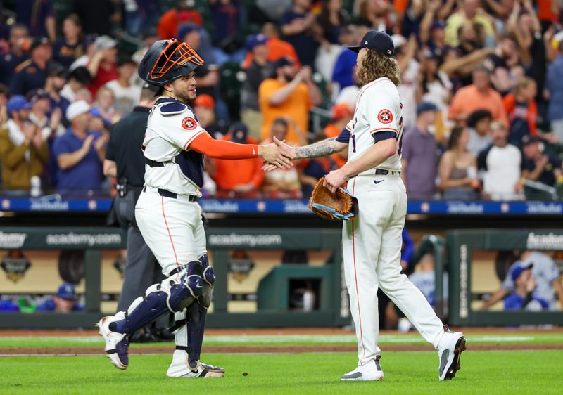 Aug 29, 2024; Houston, Texas, USA;  Houston Astros catcher Yainer Diaz (21) shakes hands with  relief pitcher Josh Hader (71) after defeating the Kansas City Royals at Minute Maid Park. Mandatory Credit: Thomas Shea-USA TODAY Sports