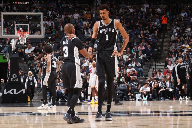 SAN ANTONIO, TX - NOVEMBER 23: Victor Wembanyama #1 and Chris Paul #3 of the San Antonio Spurs high five during the game against the Golden State Warriors on November 23, 2024 at the Frost Bank Center in San Antonio, Texas. NOTE TO USER: User expressly acknowledges and agrees that, by downloading and or using this photograph, user is consenting to the terms and conditions of the Getty Images License Agreement. Mandatory Copyright Notice: Copyright 2024 NBAE (Photos by Nathaniel S. Butler/NBAE via Getty Images)