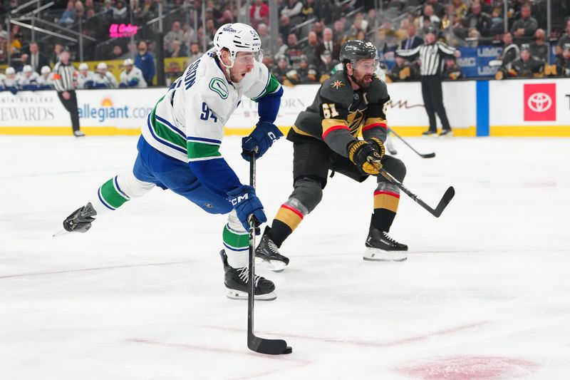 Feb 4, 2026; Las Vegas, Nevada, USA; Vancouver Canucks center Linus Karlsson (94) shoots beside Vegas Golden Knights right wing Mark Stone (61) during the first period at T-Mobile Arena. Mandatory Credit: Stephen R. Sylvanie-Imagn Images