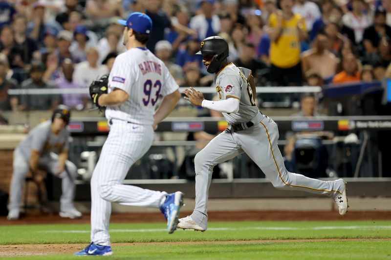 Aug 15, 2023; New York City, New York, USA; Pittsburgh Pirates shortstop Liover Peguero (60) scores a run against New York Mets relief pitcher Grant Hartwig (93) on a passed ball during the seventh inning at Citi Field. Mandatory Credit: Brad Penner-USA TODAY Sports