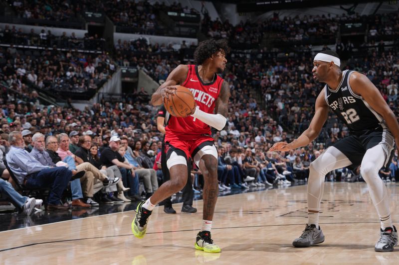SAN ANTONIO, TX - MARCH 12: Jalen Green #4 of the Houston Rockets handles the ball during the game against the San Antonio Spurs on March 12, 2024 at the Frost Bank Center in San Antonio, Texas. NOTE TO USER: User expressly acknowledges and agrees that, by downloading and or using this photograph, user is consenting to the terms and conditions of the Getty Images License Agreement. Mandatory Copyright Notice: Copyright 2024 NBAE (Photos by Jesse D. Garrabrant/NBAE via Getty Images)