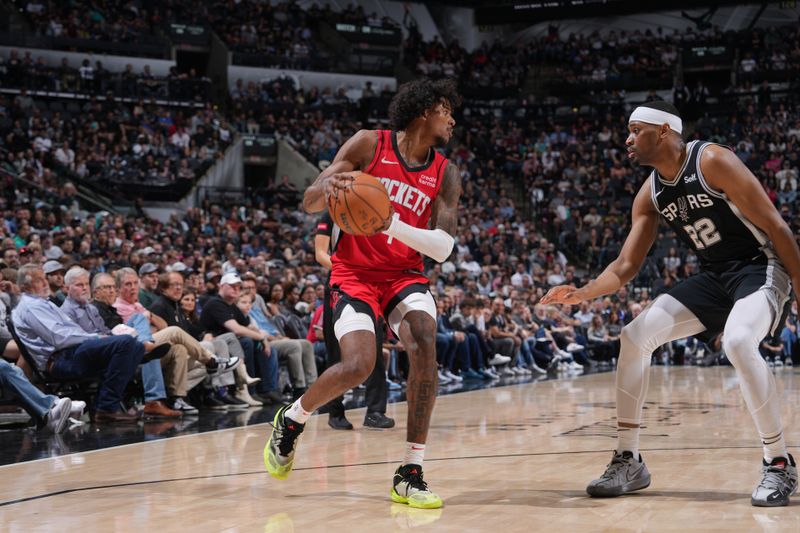 SAN ANTONIO, TX - MARCH 12: Jalen Green #4 of the Houston Rockets handles the ball during the game against the San Antonio Spurs on March 12, 2024 at the Frost Bank Center in San Antonio, Texas. NOTE TO USER: User expressly acknowledges and agrees that, by downloading and or using this photograph, user is consenting to the terms and conditions of the Getty Images License Agreement. Mandatory Copyright Notice: Copyright 2024 NBAE (Photos by Jesse D. Garrabrant/NBAE via Getty Images)