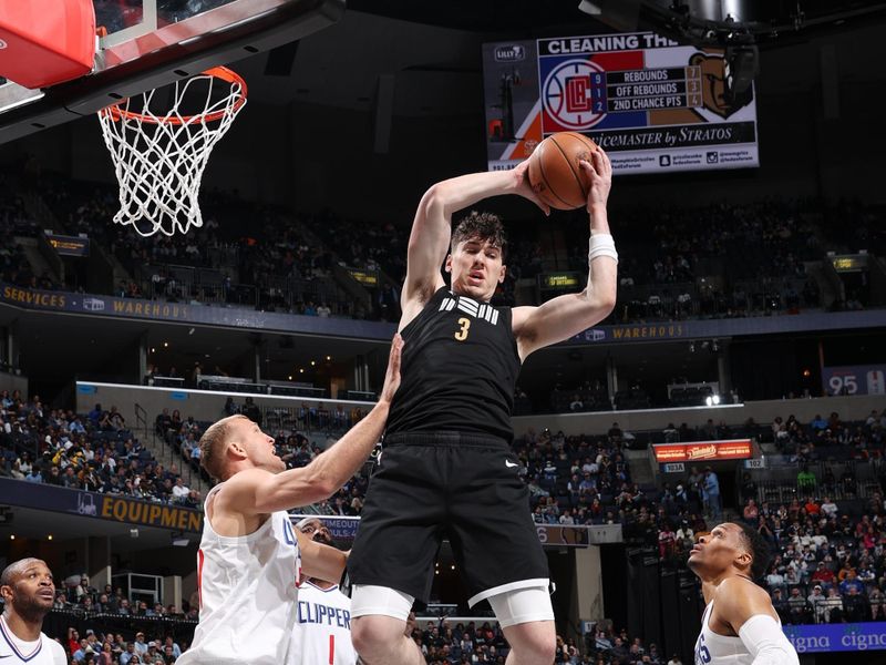 MEMPHIS, TN - FEBRUARY 23: Jake LaRavia #3 of the Memphis Grizzlies rebounds the ball during the game against the LA Clippers on February 23, 2024 at FedExForum in Memphis, Tennessee. NOTE TO USER: User expressly acknowledges and agrees that, by downloading and or using this photograph, User is consenting to the terms and conditions of the Getty Images License Agreement. Mandatory Copyright Notice: Copyright 2024 NBAE (Photo by Joe Murphy/NBAE via Getty Images)