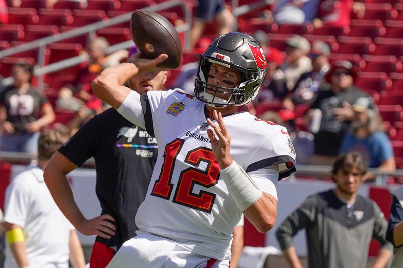 Tampa Bay Buccaneers quarterback Tom Brady warms up before the first half of an NFL football game between the Tampa Bay Buccaneers and the Atlanta Falcons Sunday, Oct. 9, 2022, in Tampa, Fla. (AP Photo/Chris O'Meara)