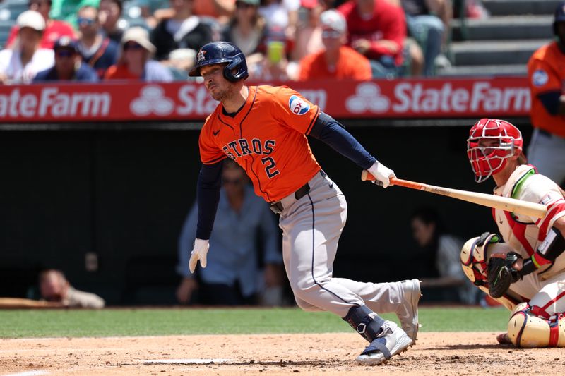 Jun 9, 2024; Anaheim, California, USA;  Houston Astros third baseman Alex Bregman (2) hits an RBI double during the third inning against the Los Angeles Angels at Angel Stadium. Mandatory Credit: Kiyoshi Mio-USA TODAY Sports