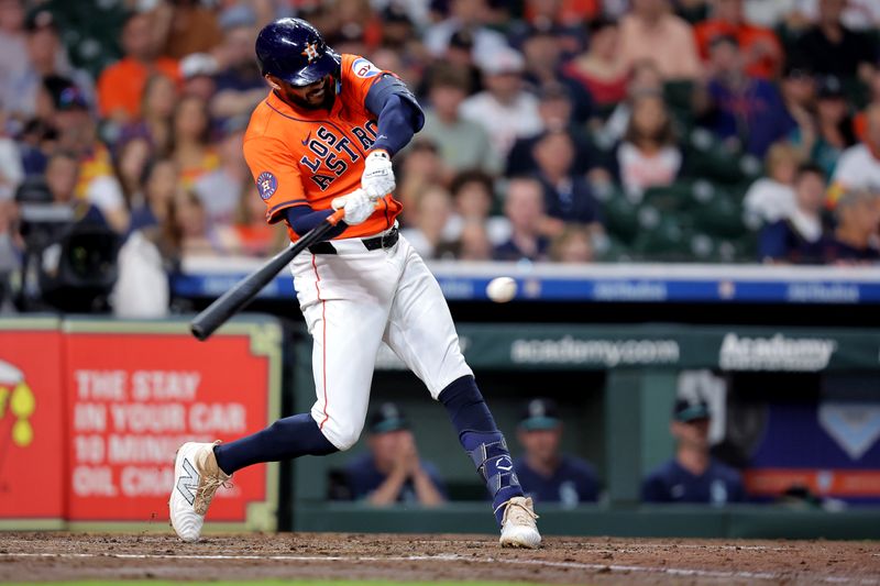 Sep 19, 2025; Houston, Texas, USA; Houston Astros third baseman Carlos Correa (1) hits a double to right-center field against the Seattle Mariners during the fourth inning at Daikin Park. Mandatory Credit: Erik Williams-Imagn Images