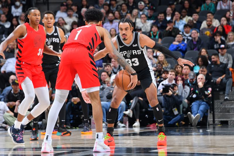 SAN ANTONIO, TX - JANUARY 26: Tre Jones #33 of the San Antonio Spurs plays defense during the game against the Portland Trail Blazers on January 26, 2024 at the Frost Bank Center in San Antonio, Texas. NOTE TO USER: User expressly acknowledges and agrees that, by downloading and or using this photograph, user is consenting to the terms and conditions of the Getty Images License Agreement. Mandatory Copyright Notice: Copyright 2024 NBAE (Photos by Michael Gonzales/NBAE via Getty Images)