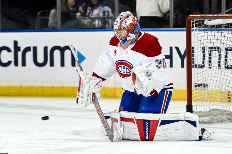 Nov 30, 2024; New York, New York, USA; Montreal Canadiens goaltender Cayden Primeau (30) warms up before the game against the New York Rangers at Madison Square Garden. Mandatory Credit: John Jones-Imagn Images