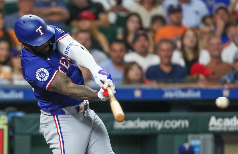 Jul 12, 2024; Houston, Texas, USA; Texas Rangers right fielder Adolis Garcia (53) hits a single against the Houston Astros in the sixth inning at Minute Maid Park. Mandatory Credit: Thomas Shea-USA TODAY Sports