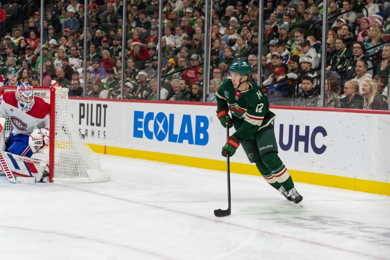 Dec 21, 2023; Saint Paul, Minnesota, USA; Minnesota Wild left wing Matt Boldy (12) skates around the net against the Montreal Canadiens in the third period at Xcel Energy Center. Mandatory Credit: Matt Blewett-USA TODAY Sports