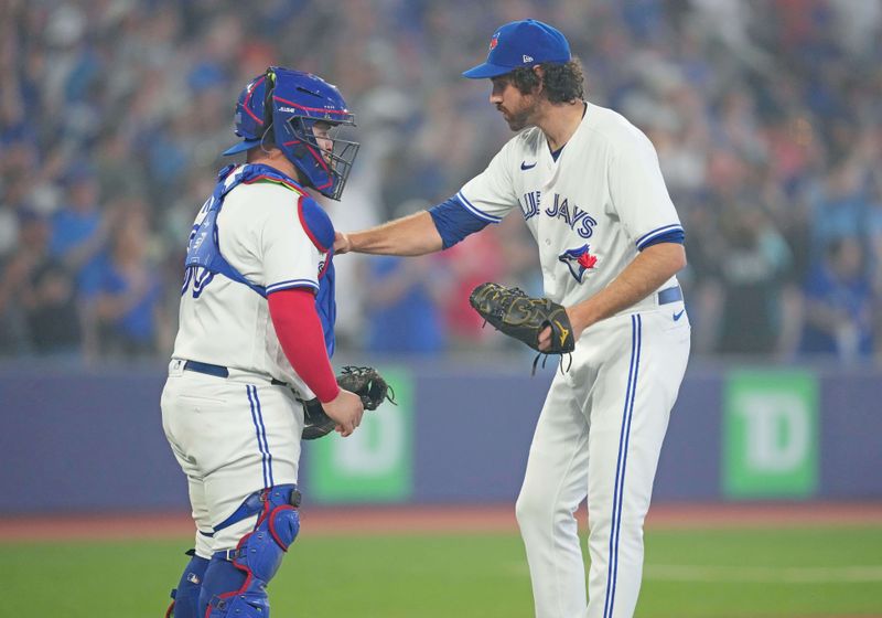 Jun 29, 2023; Toronto, Ontario, CAN; Toronto Blue Jays relief pitcher Jordan Romano (68) celebrates the win with Toronto Blue Jays catcher Alejandro Kirk (30) against the San Francisco Giants at the end of the ninth inning at Rogers Centre. Mandatory Credit: Nick Turchiaro-USA TODAY Sports