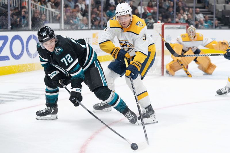 Feb 24, 2024; San Jose, California, USA; San Jose Sharks left wing William Eklund (72) and Nashville Predators defenseman Jeremy Lauzon (3) fight for control of the puck during the second period at SAP Center at San Jose. Mandatory Credit: Stan Szeto-USA TODAY Sports