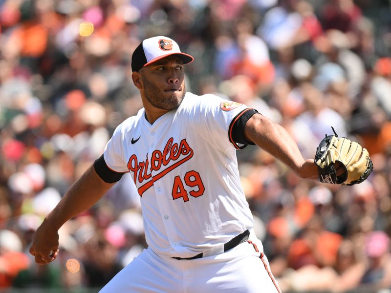 Apr 28, 2024; Baltimore, Maryland, USA;  Baltimore Orioles starting pitcher Albert Suarez (49) delivers a pitch during the first inning against the Oakland Athletics at Oriole Park at Camden Yards. Mandatory Credit: James A. Pittman-USA TODAY Sports