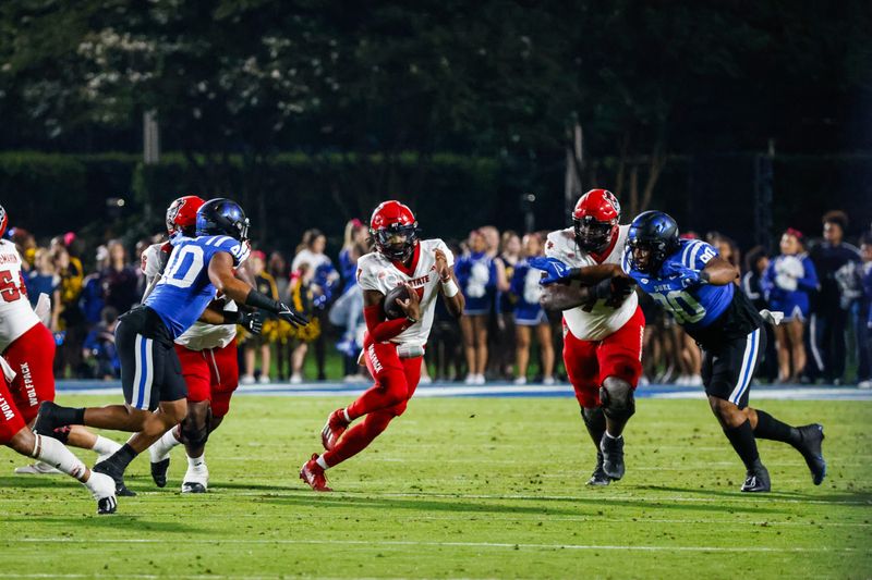 Oct 14, 2023; Durham, North Carolina, USA; North Carolina State Wolfpack quarterback MJ Morris (7) runs with the football during the first half of the game against Duke Blue Devils at Wallace Wade Stadium. Mandatory Credit: Jaylynn Nash-USA TODAY Sports