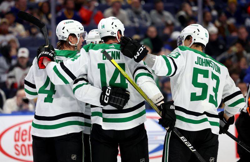 Mar 9, 2023; Buffalo, New York, USA;  Dallas Stars left wing Jamie Benn (14) celebrates his goal with teammates during the first period against the Buffalo Sabres at KeyBank Center. Mandatory Credit: Timothy T. Ludwig-USA TODAY Sports