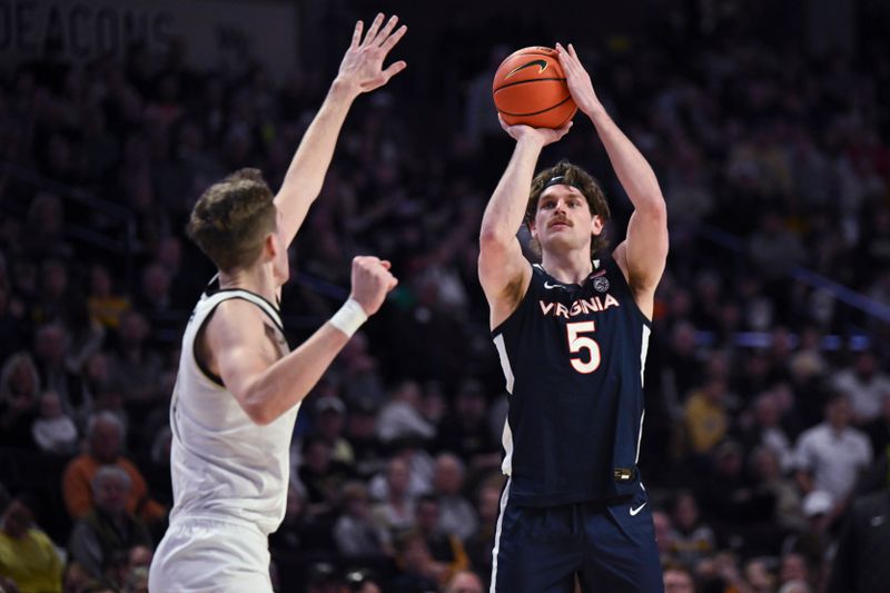 Jan 21, 2023; Winston-Salem, North Carolina, USA;  Virginia Cavaliers forward Ben Vander Plas (5) shoots against Wake Forest Demon Deacons defender during the second half at Lawrence Joel Veterans Memorial Coliseum. Mandatory Credit: William Howard-USA TODAY Sports