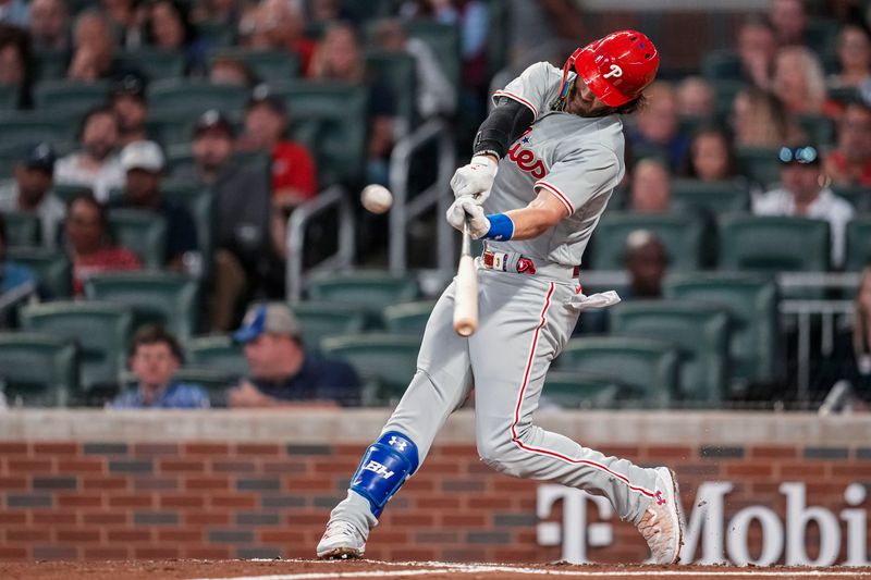 Sep 18, 2023; Cumberland, Georgia, USA; Philadelphia Phillies first baseman Bryce Harper (3) hits a home run against the Atlanta Braves during the third inning at Truist Park. Mandatory Credit: Dale Zanine-USA TODAY Sports