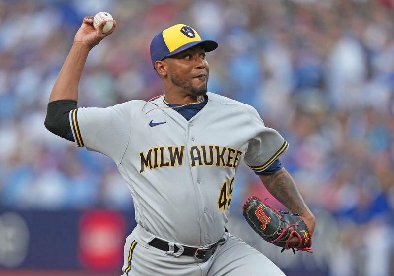 May 31, 2023; Toronto, Ontario, CAN; Milwaukee Brewers starting pitcher Julio Teheran (49) throws a pitch against the Toronto Blue Jays during the first inning at Rogers Centre. Mandatory Credit: Nick Turchiaro-USA TODAY Sports