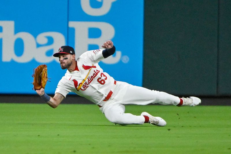 May 26, 2024; St. Louis, Missouri, USA;  St. Louis Cardinals center fielder Michael Siani (63) dives and catches a line drive against the Chicago Cubs during the eighth inning at Busch Stadium. Mandatory Credit: Jeff Curry-USA TODAY Sports
