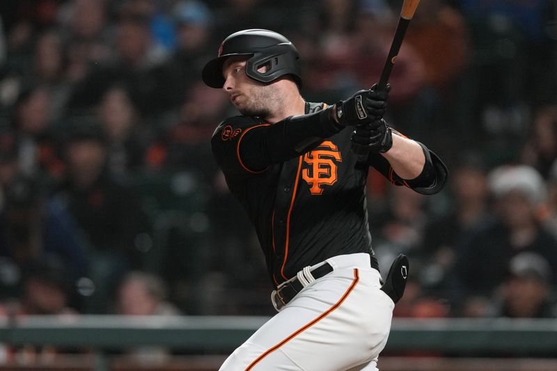 Jun 3, 2023; San Francisco, California, USA;  San Francisco Giants pinch hitter Austin Slater (13) hits an RBI single against the Baltimore Orioles during the sixth inning at Oracle Park. Mandatory Credit: Darren Yamashita-USA TODAY Sports